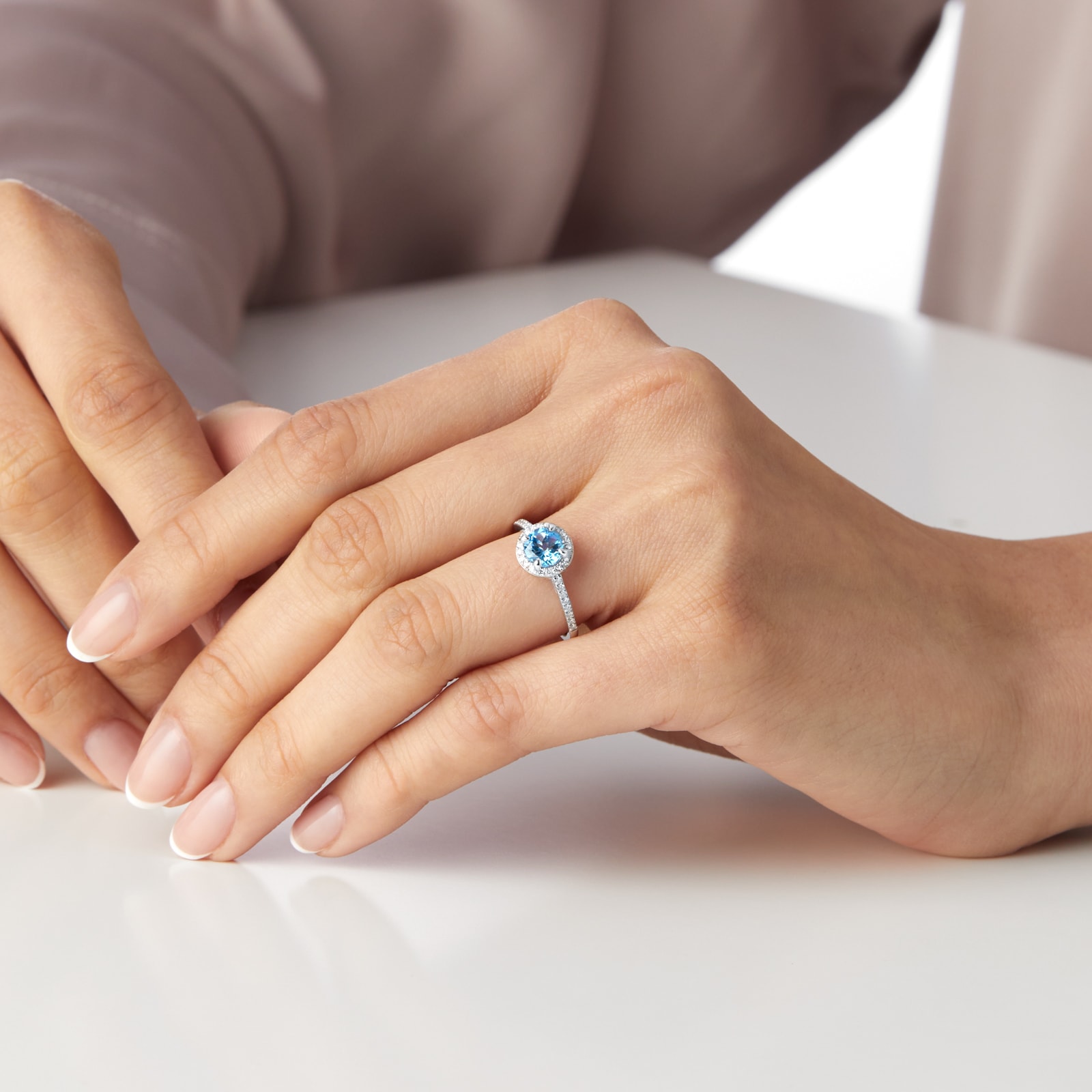 Goldsmiths 9ct White Gold 6x6mm Blue Topaz And Diamond Round Halo Ring Goldsmiths 9ct White Gold 6x6mm Blue Topaz And Diamond Round Halo Ring